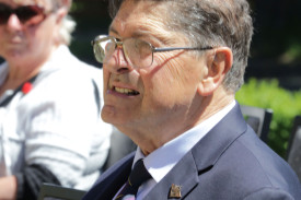 Chaplain Geoff Webb watches on during the service.