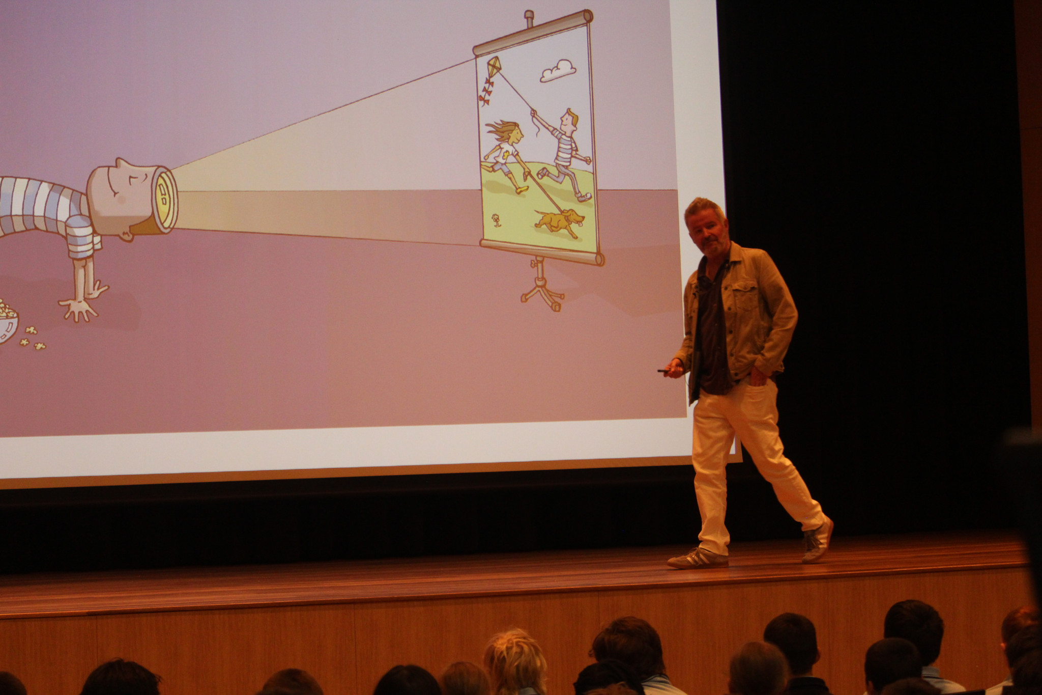 Matthew Johnstone presents to the crowd his illustrations about topics including worry, anxiety, mental health and many more. (Photo: Antony Dubber)