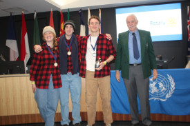 Bowral High School students Chloe Ward (left), Michael Tonkinson and Joshua McKay (representing Canada) with Rotary’s Robert deJongh.