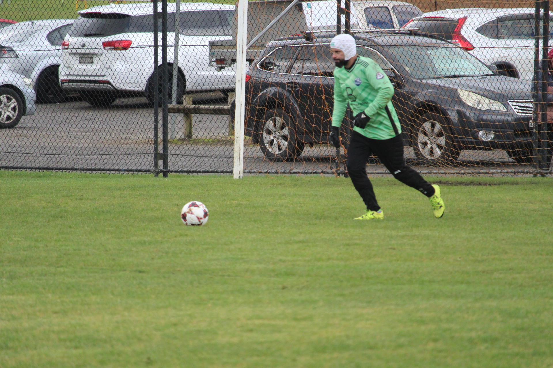 Bowral goalkeeper Larry Mullan saves a Robertson goal attempt.