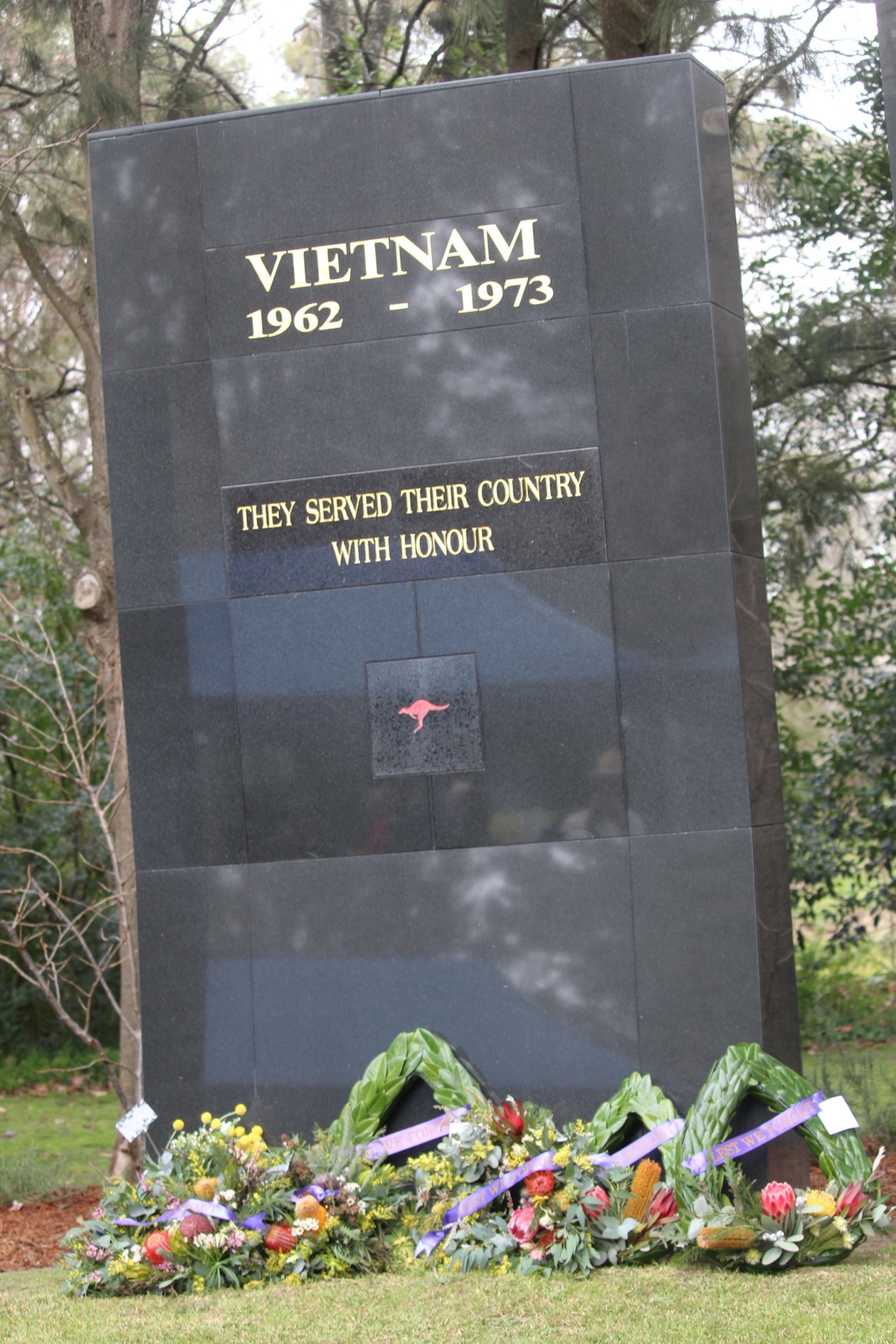 The wreaths laid at the foot of the Vietnam War Memorial located at the Cherry Tree Walk in Bowral. (Photo: Antony Dubber)
