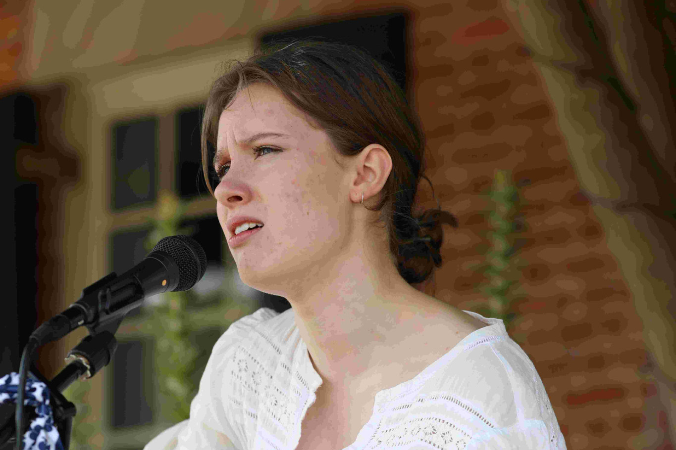 Eighteen-year-old Freya Clohessy of Bowral busking at the recent Australia Day celebrations in Berrima. Photo Stuart Carless.