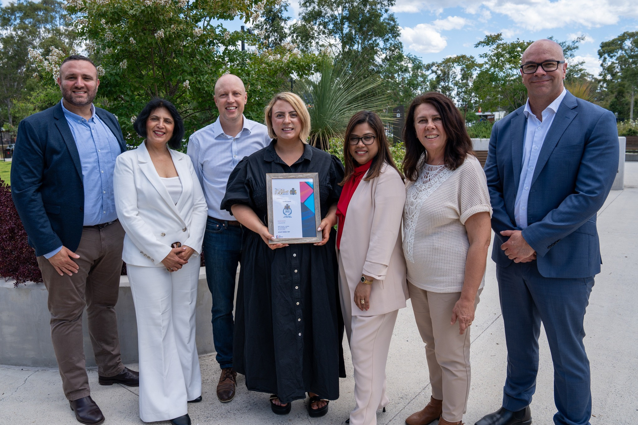 Camden Council Deputy Mayor Ashleigh Cagney (centre) holds the AR Bluett Award which her council has been awarded. She is pictured with Director of Sport, Community and Activation, Casli Mehmed, Councillor Dr. Abha Suri, Councillor Damien Quinnell, Councillor Eliza Rahman, Councillor Rose Sicari and General Manager Andrew Carfield. (Photo: Camden Council)