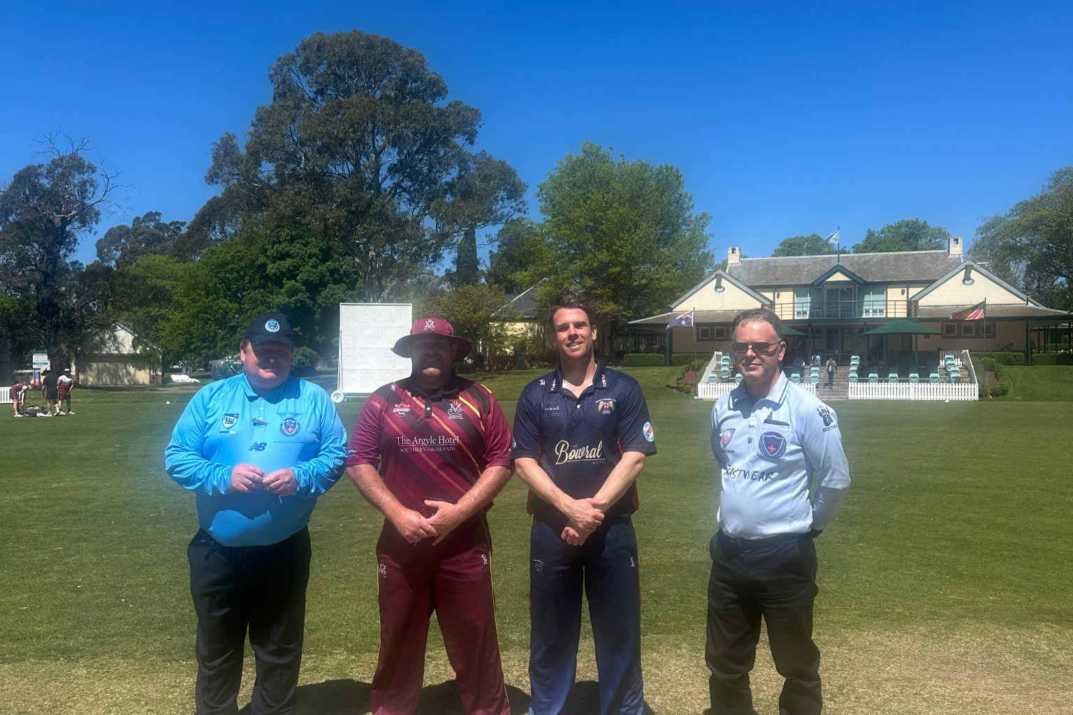 Moss Vale Captain Dean Roxburgh with Bowral Captain Alex Deane and Umpires at Bradman Oval on Saturday